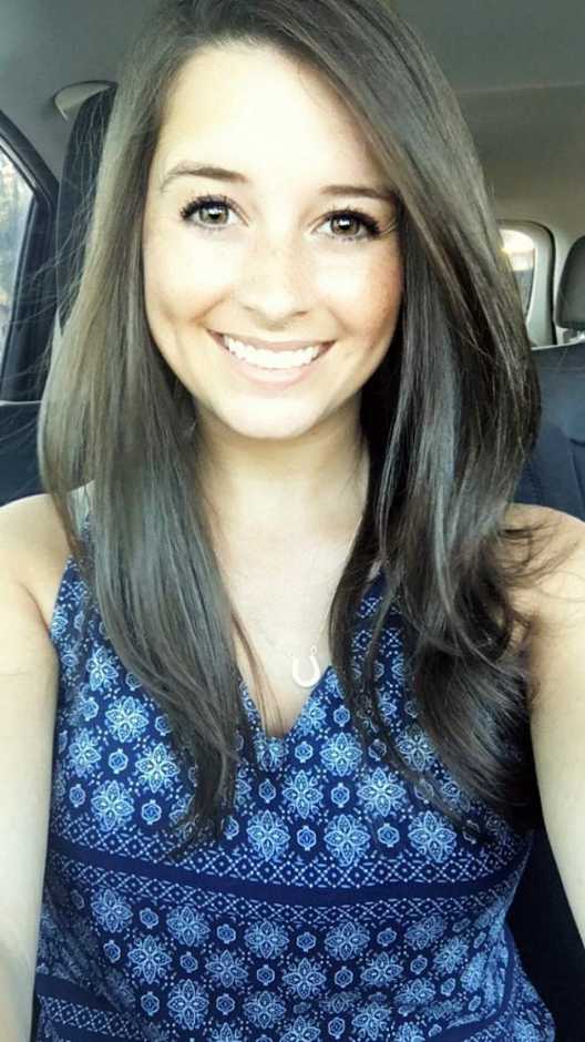 Selfie of a young lady sitting in her car